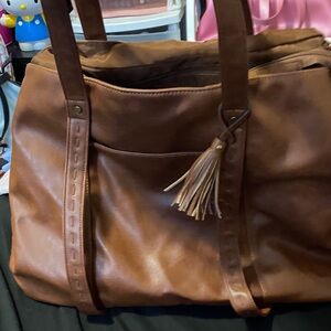 Elegant Brown Tote with Tassel Accent